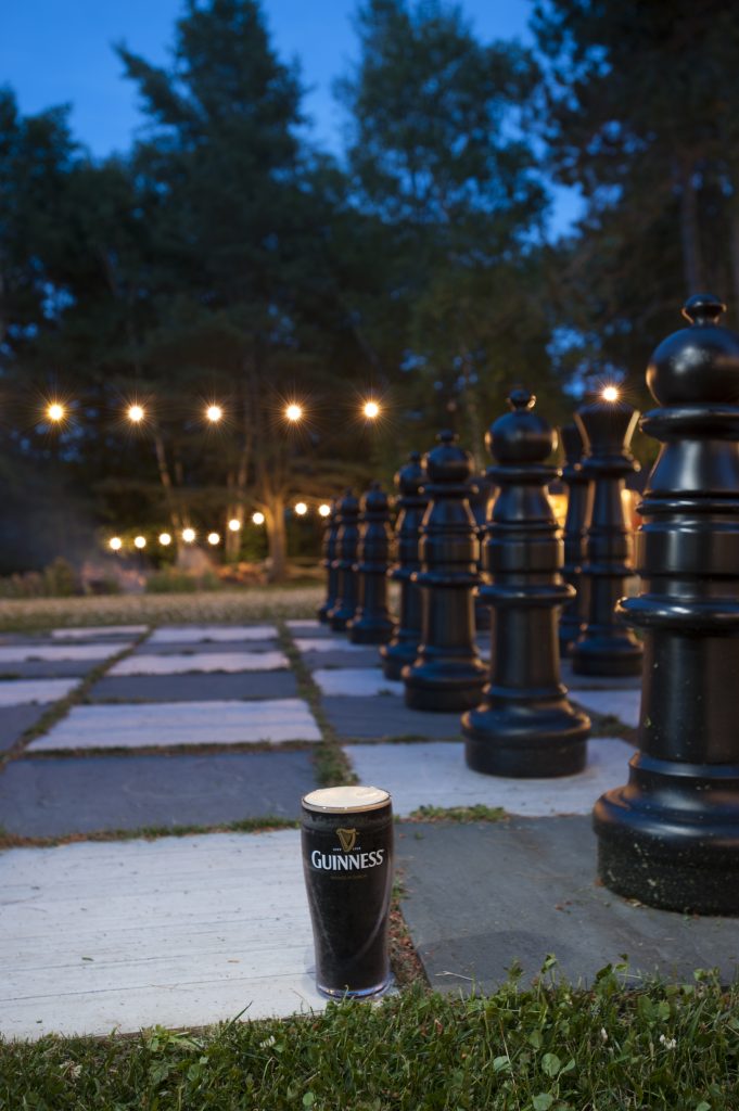 Giant Chess at Night with a Pint